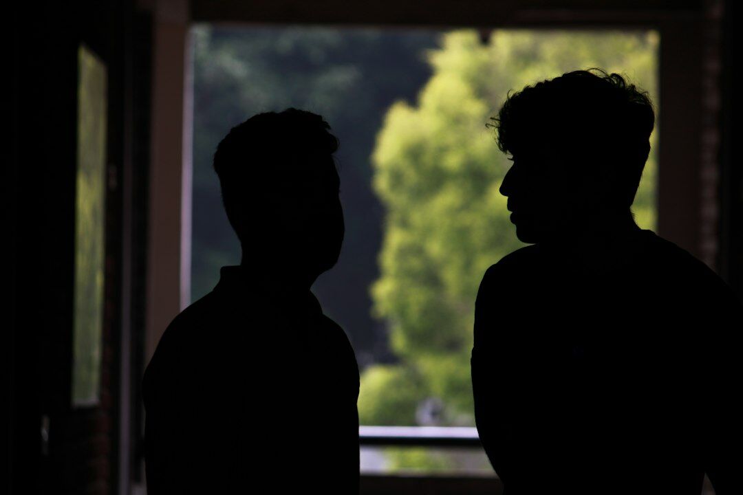 mysterious conversation in dim light