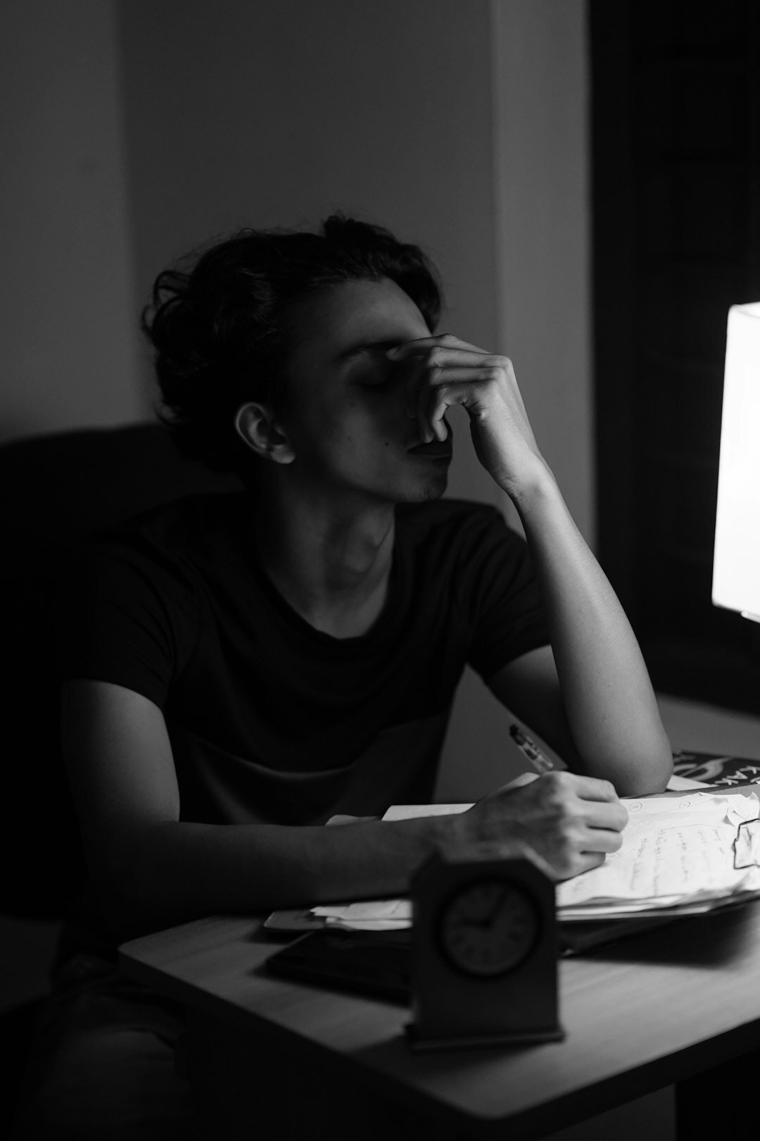 writer at desk at night